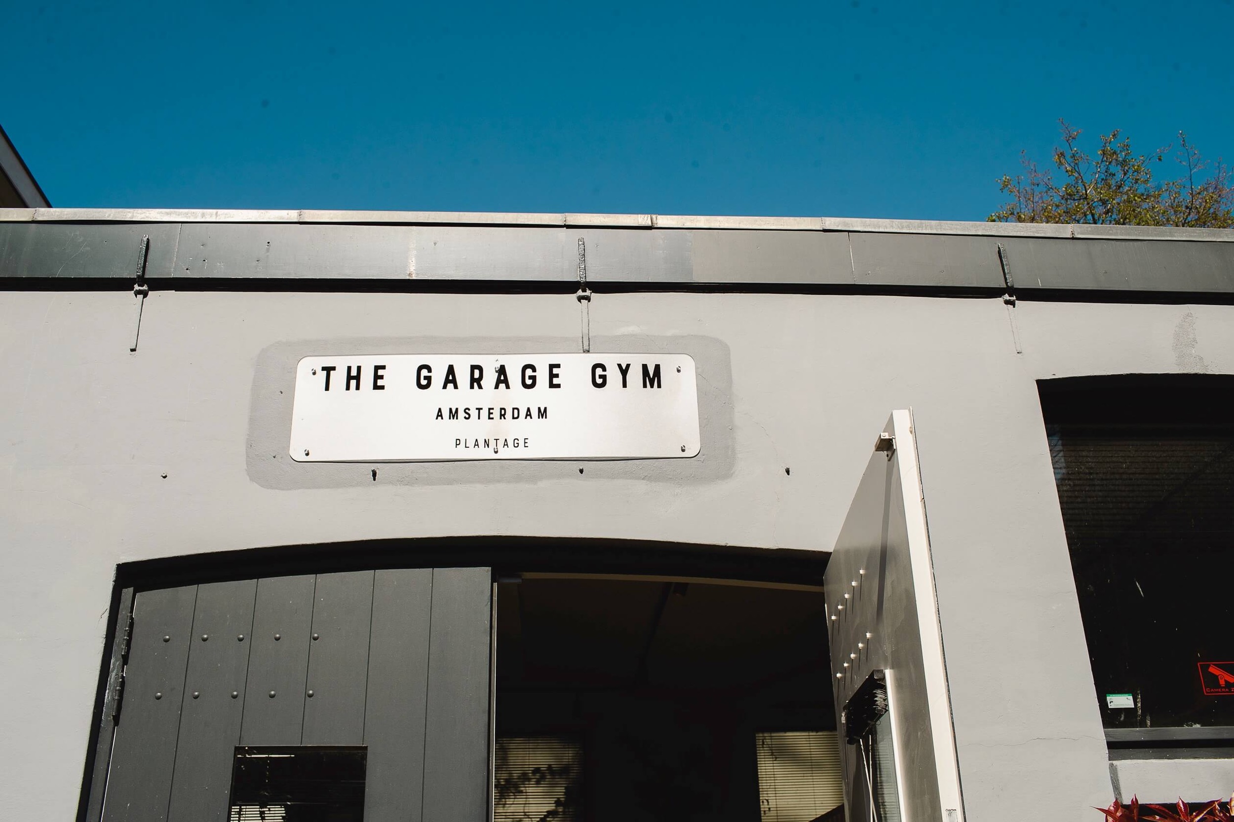 the garage gym location plantage sign front door